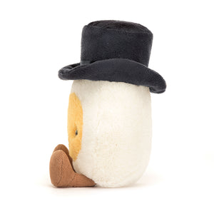 Side View: Dashing Jellycat Amuseable Boiled Egg Groom plush in profile, showcasing soft corduroy feet, top hat, and bow tie.