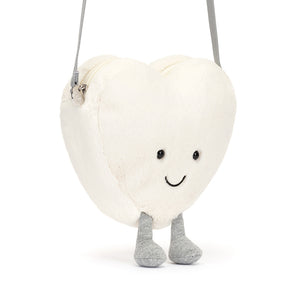 Hanging View: Carry your love on the go! The Jellycat Cream Heart Bag with its sparkly cord "boots" is a cute and cuddly accessory.