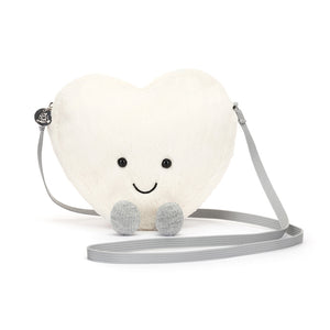 Front View: Sending love everywhere! The Jellycat Amuseable Cream Heart Bag, a cuddly tote with a secure zip closure and sparkly cord "boots."