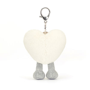 Back View: Add a touch of whimsy! The Jellycat Cream Heart Bag Charm, a delightful way to personalize your bag with a touch of love.