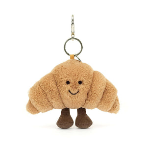 Straight on view of the Jellycat Amuseable Croissant Bag charm.