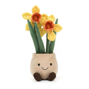 Front view of the cuddly Jellycat Amuseable Daffodil Pot. This high-quality plush features a beige pot with cordy boots, a friendly smile, and vibrant suedette daffodils with sunny yellow trumpets. Makes a delightful gift for all ages.