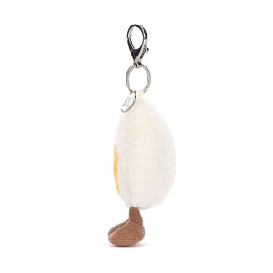 A side view of Jellycat Amuseable Happy Boiled Egg Bag Charm.