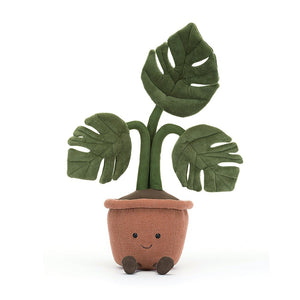 A cheerful Monstera plush toy with warm terracotta pot, latte-colored soil, and realistic suedette leaves greets you with a friendly smile. This Jellycat Amuseable Monstera is ready to brighten your day!