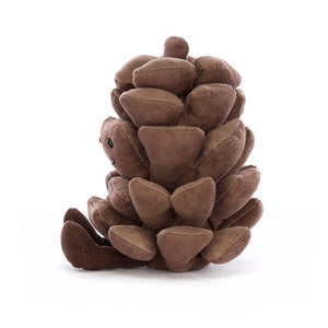 From the side the Jellycat Amuseable Pine Cone children's plush toy sits with his legs out in front. 