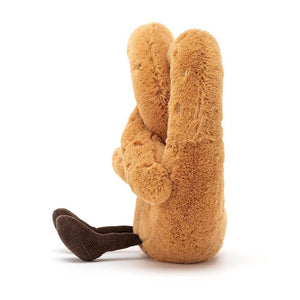 See the delicious details of the Amuseable Pretzel! This soft plush toy features a golden brown body, cute cocoa cord boots, and playful salt speckles.