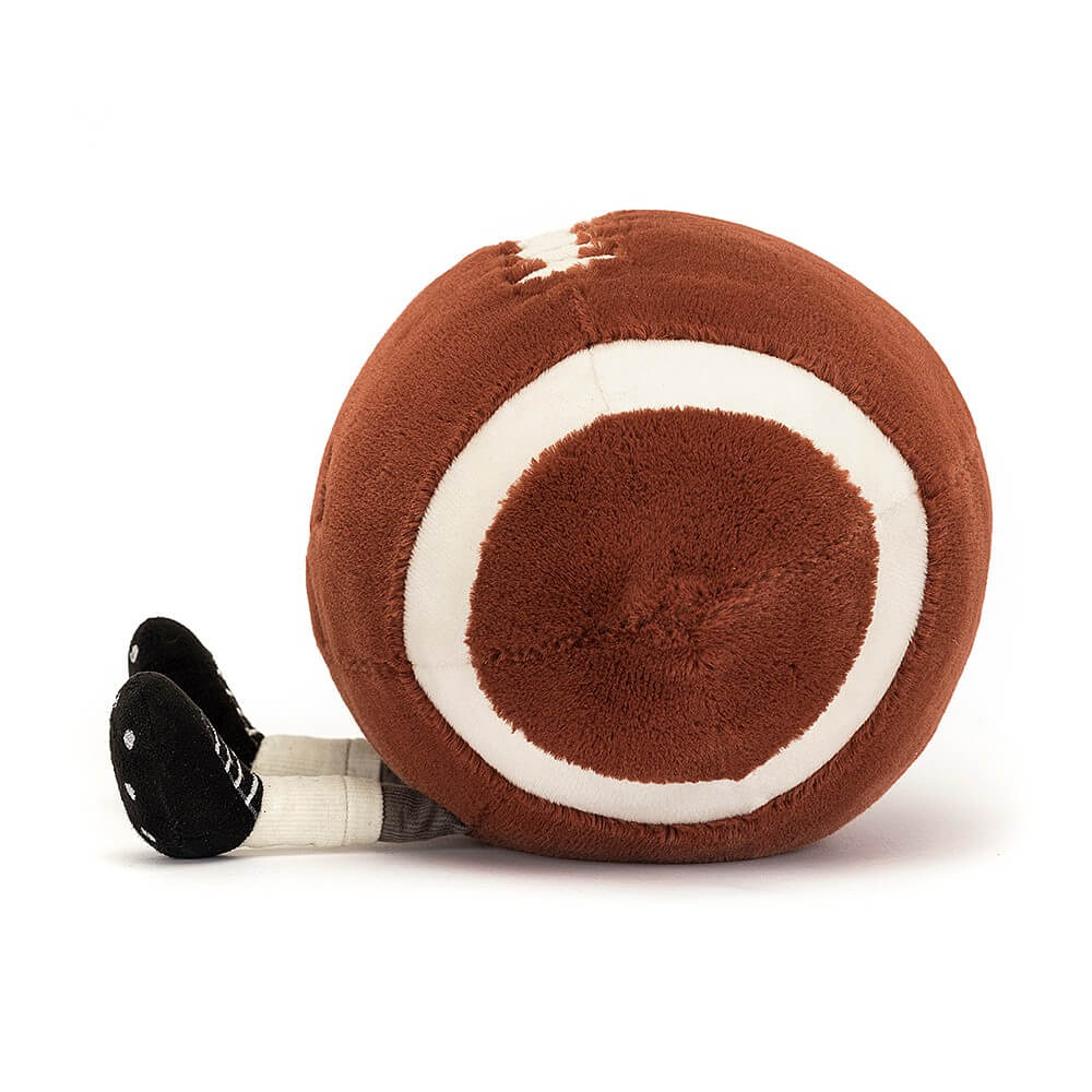 Get a side view of the cuddly Jellycat Football! 28cm of plush fun with realistic stitching, laces, and adorable cleats. A touchdown for playtime!
