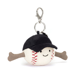 Angled View: Take your love for the game on the go! The Jellycat Sports Baseball Bag Charm with its red stitching and cuddly plush texture is a playful addition to any bag.