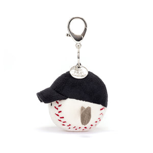 Side View: A perfect squeeze for baseball fans! The Jellycat Sports Baseball Bag Charm is a soft and cuddly companion with a secure clasp for attaching to bags.