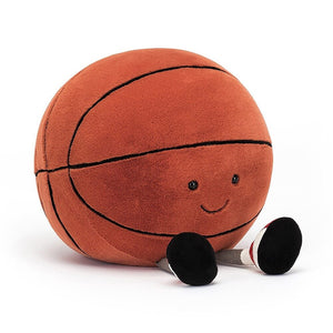 Children's soft toy from Jellycat in the shape and image of a basketball with tiny little legs.