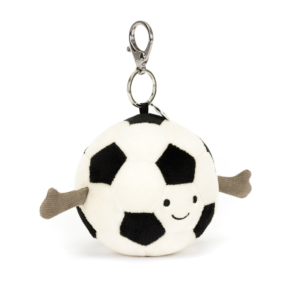Angled View: Carry your football spirit everywhere! The Jellycat Sports Football Bag Charm with its black and white details and cuddly texture is a playful addition to any bag.