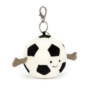 Angled View: Carry your football spirit everywhere! The Jellycat Sports Football Bag Charm with its black and white details and cuddly texture is a playful addition to any bag.