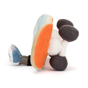 Side profile of the Jellycat Amuseables Sports Skateboarding, showing its full skateboard design, thickness for cuddling, corded legs and trainers and cool 3D wheels.