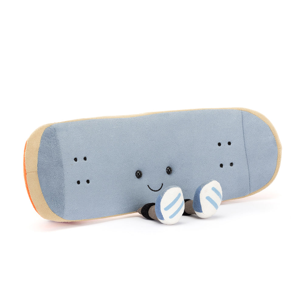 Adorable Jellycat Amuseables Sports Skateboarding facing front, highlighting its embroidered facial features and skateboard shape.
