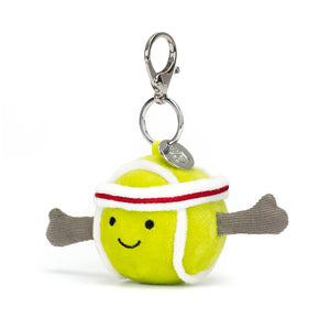 Angled View: Ace your accessory game! The Jellycat Sports Tennis Bag Charm with its soft plush texture and realistic details is a fun addition to any bag.