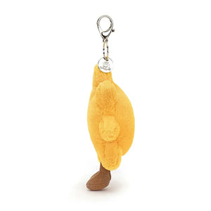 Brighten up your day with the Jellycat Amuseable Sun Bag Charm! This cuddly plush sun features a friendly smile, cozy golden fur, and adorable milk chocolate corduroy boots. It's the perfect accessory to add a touch of sunshine to your bags, backpacks, or keys.