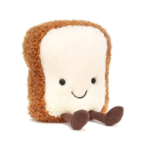 Children's soft toy from Jellycat in the shape of a slice of toast and with a big smile and corduroy legs.