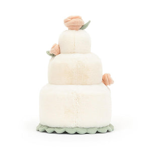 From behind the Jellycat Amuseable Wedding Cake children's soft toy.