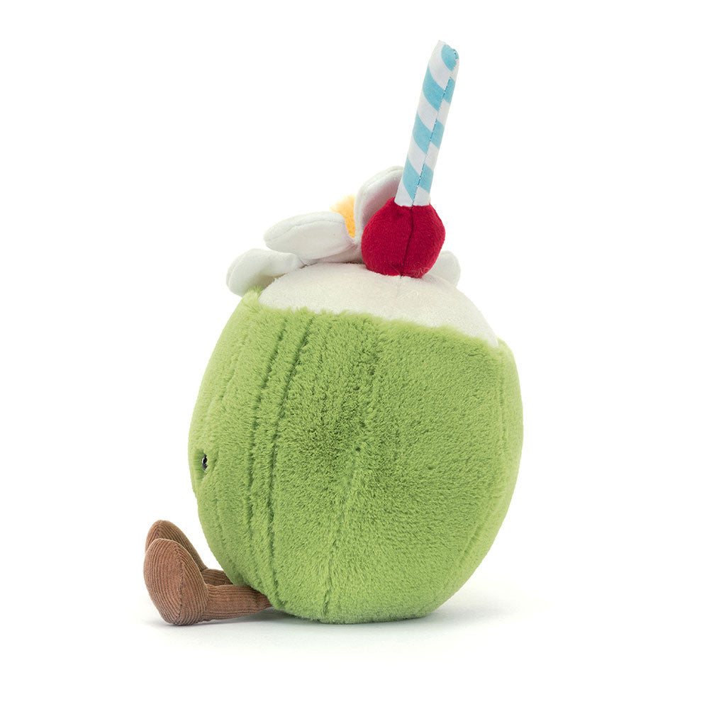 Side view of Jellycat Amuseables Aruba Coconut plush, showing the soft green body, plush legs, and decorative cherry and flower detail on top.