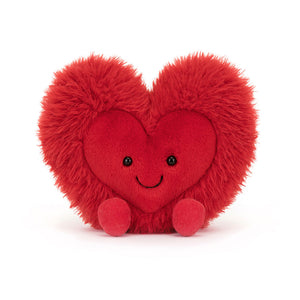 Front View: Jellycat Amuseables Beatie Heart plush toy, soft and cuddly, red heart with a mischievous grin.