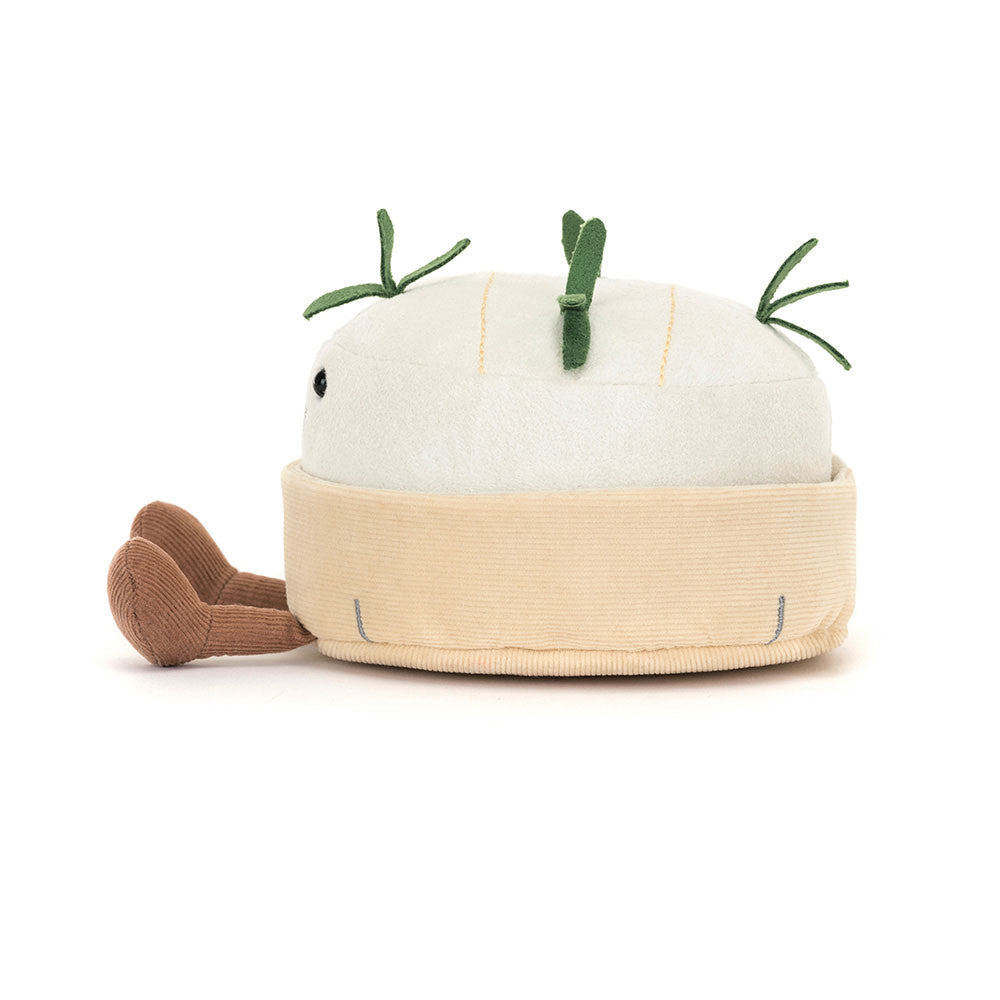 Side view of Jellycat Amuseables Camembert plush toy showing beige rind and green stitched detail.