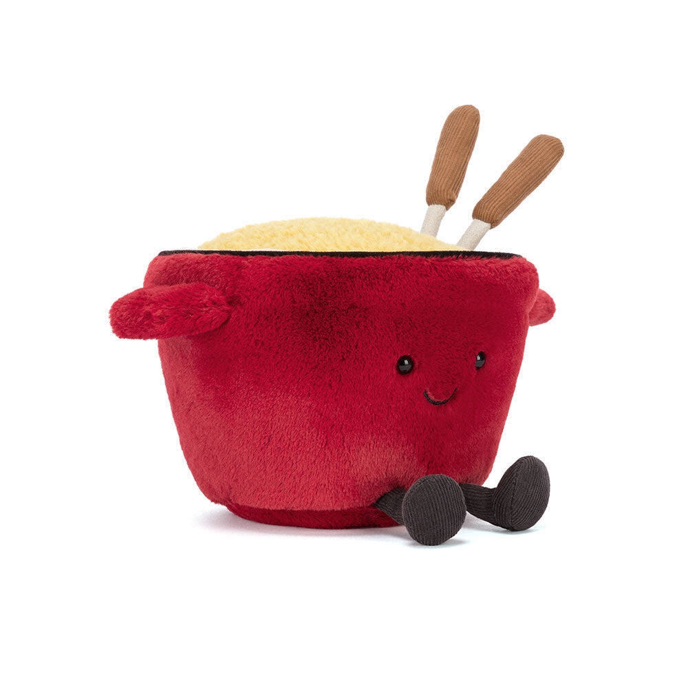 Jellycat Amuseables Cheese Fondue plush toy in a red pot with smiling face and fluffy yellow cheese top, featuring soft corduroy forks.