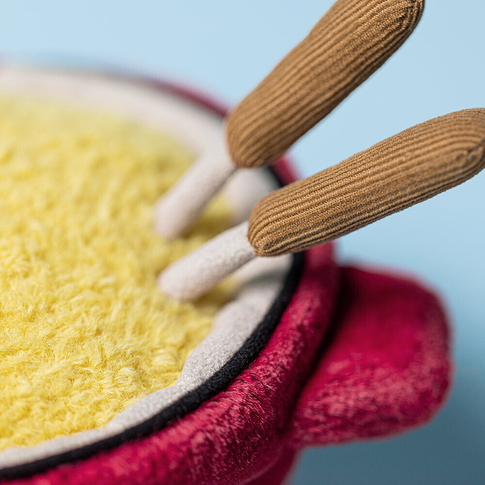 Close-up of Jellycat Cheese Fondue plush showing textured yellow cheese and corduroy forks.