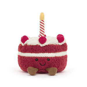 Front  View: Jellycat Amuseables Cheri Cake  showcasing its embroidered facial features and cord booties.