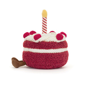 Side View: Jellycat Amuseables Cheri Cake highlighting its soft, cuddly texture and realistic cake shape.