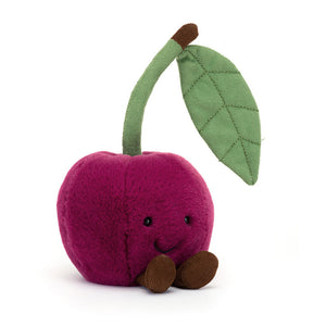 Angled View : The Jellycat Amuseables Cherry, showcasing a plump cherry with a friendly stitch smile and cute corded boots. Fuzzy green leaves and a green and cocoa cord stem. Perfect for playful pretend picnics!