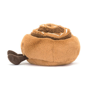 Side view of Jellycat Amuseables Cinnamon Bun showing swirled icing details.