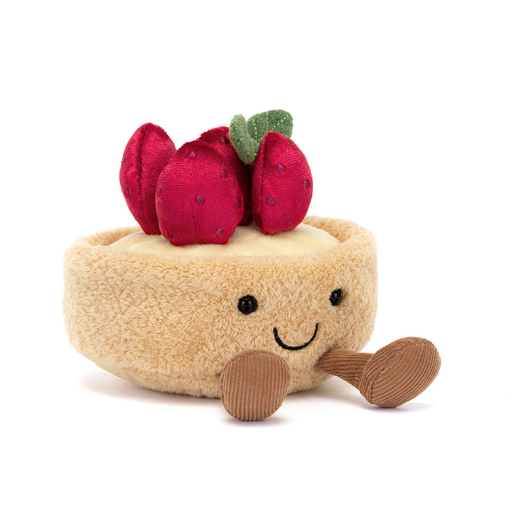 Front view of Jellycat Amuseables Fleurette Tarte Aux Fraises plush toy, featuring a soft golden pastry base and smiling embroidered face.