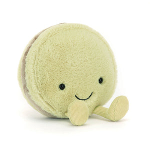 A pastel green Jellycat Amuseables Max Macaron plush toy with a smiling embroidered face and soft textures.