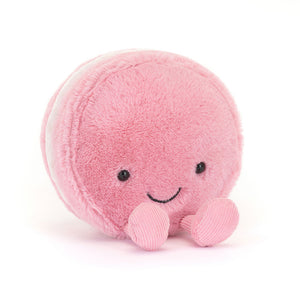 Jellycat Amuseables Mia Macaron plush, displayed at a slight angle, showcasing its soft strawberry fur and velvety filling.