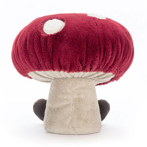 Back View: Backside of the Jellycat Amuseables Mushroom showcases the chunky red cap with a single, embroidered cream spot. This whimsical mushroom adds a touch of whimsy to any playtime adventure, whether peeking out from a basket or nestled on a shelf!