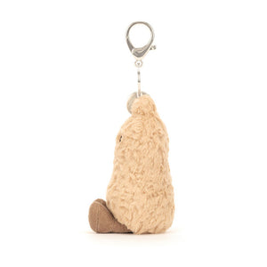 Side View: Side profile of the Jellycat Amuseables Peanut Bag Charm. 