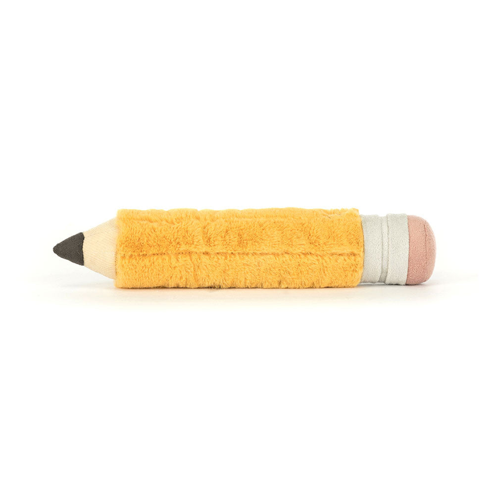 Side profile of the Jellycat Amuseables Pencil cuddly toy showing stitched detailing, pink eraser end, grey metal band, and fuzzy yellow fabric