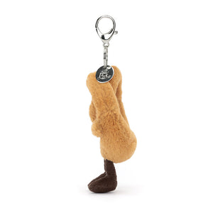 Side View: Side profile of Jellycat Pretzel Bag Charm showing soft plush and clip attachment.