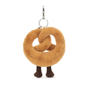 Side View: Side profile of Jellycat Pretzel Bag Charm showing soft plush and clip attachment.