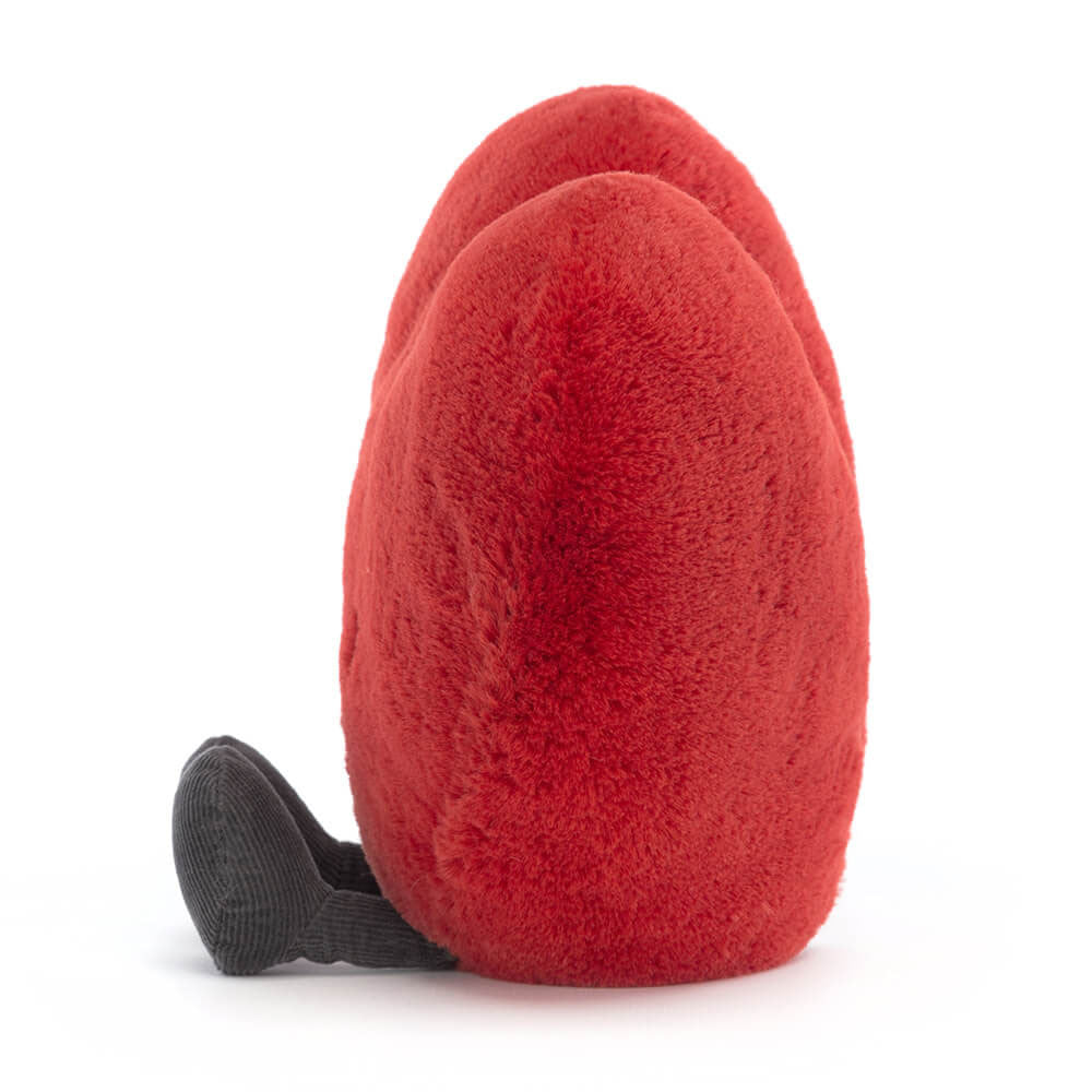Side profile of Jellycat Amuseables Large Red Heart, highlighting its plush texture, rounded shape, and whimsical design.