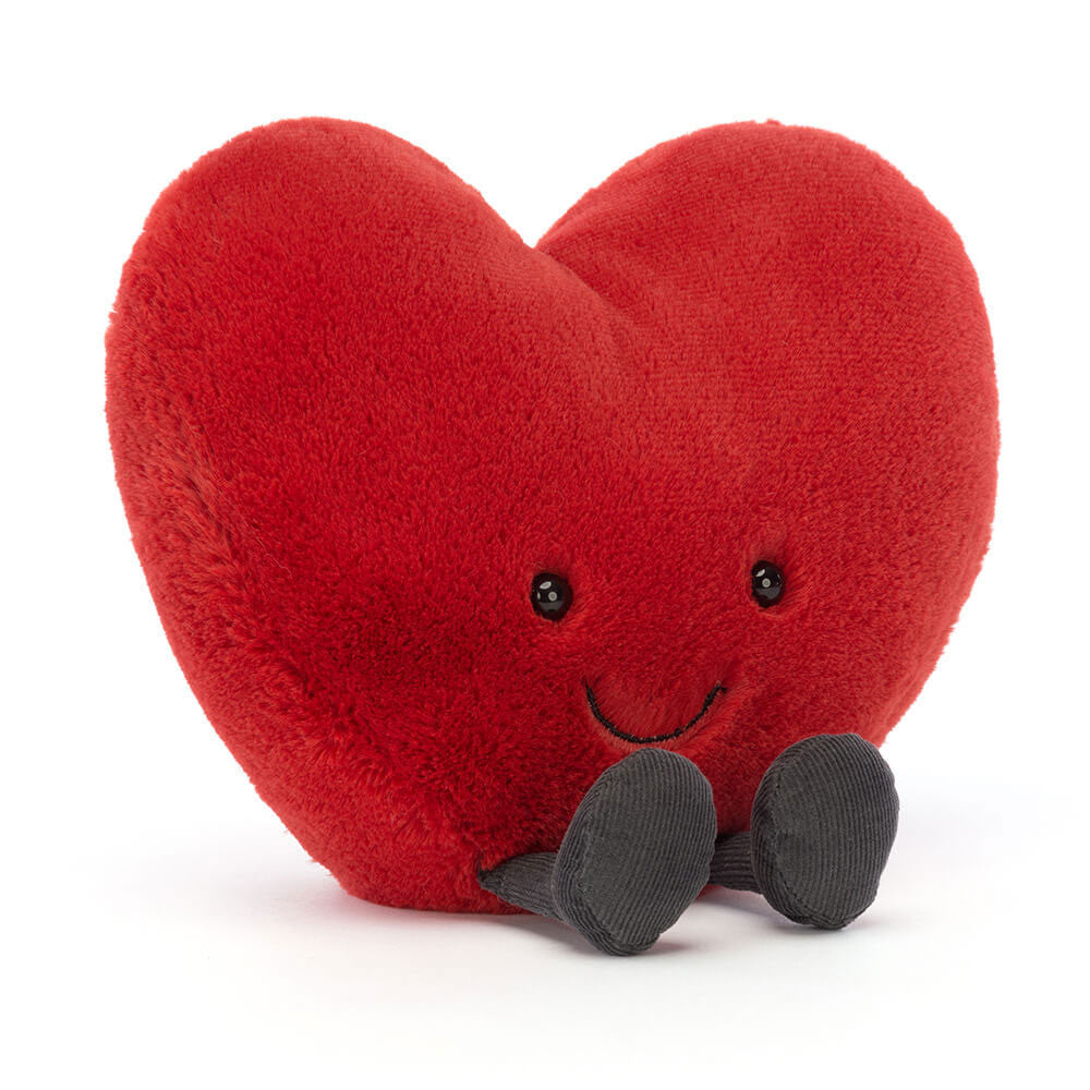 Jellycat Amuseables Large Red Heart plush toy with a vibrant red heart design, soft fabric, and cute little legs, shown from the front.
