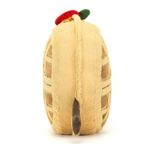 Side view of Jellycat Amuseables René Waffle, showcasing its soft plush texture and details.