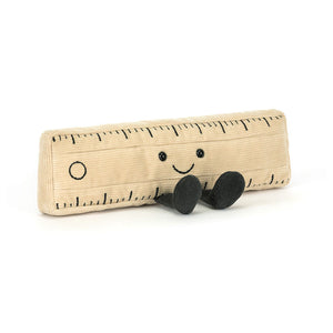 Front view of Jellycat Amuseables Ruler plush with smiley face and cord feet.