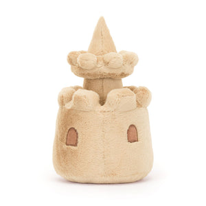Back view of Jellycat Amuseables Sandcastle soft toy with embroidered windows and soft sandy texture.