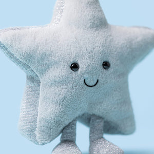 Close-up of Jellycat Amuseables Silver Star showing soft grey plush and sparkly metallic texture.