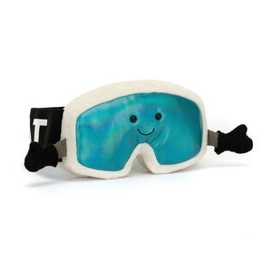 Angled View: Hit the slopes (or the couch!) in style! The Jellycat Amuseables Ski Goggles sit tilted, showcasing their cream suedette frames, dazzling holographic aqua lenses, stretchy "Jellycat" headband, and cosy grey suedette gloves.
