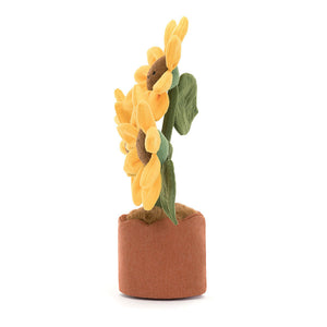 Side view of Jellycat Amuseables Sunflower showing its bright yellow petals and soft green leaves.