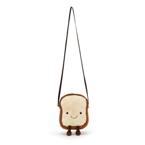 Jellycat Amuseables Toast Bag shown with its long adjustable brown strap, highlighting its playful toast design and plush details.