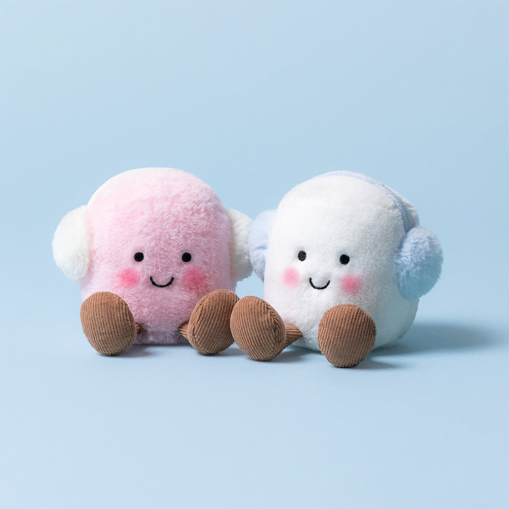 Close-up of Jellycat Amuseables Toastie Pink & White Marshmallows on blue background showing soft pink and white fur and brown corduroy legs.