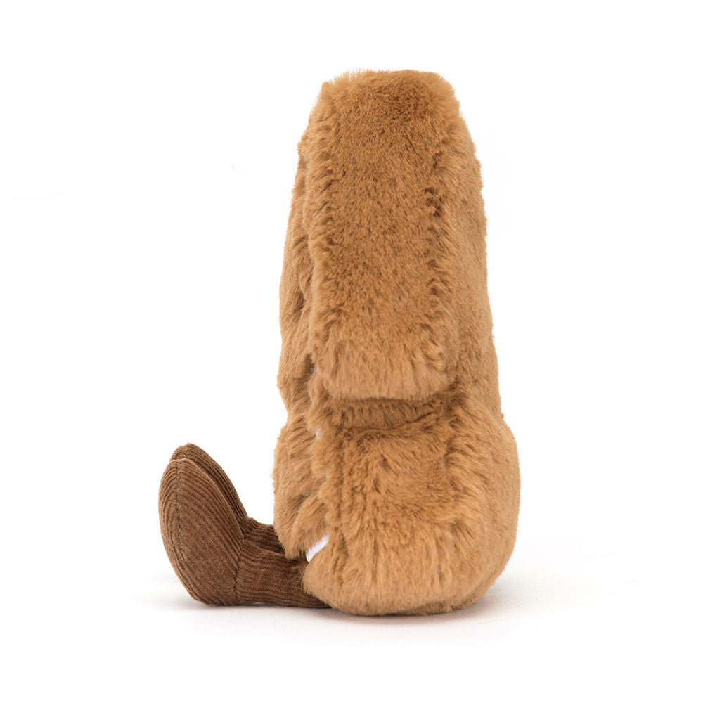 Side profile of Jellycat Amuseables Tree Cookie showing its soft brown plush texture and corduroy legs.